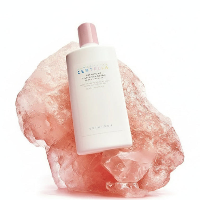 Skincare product with ingredients listed on a pink background